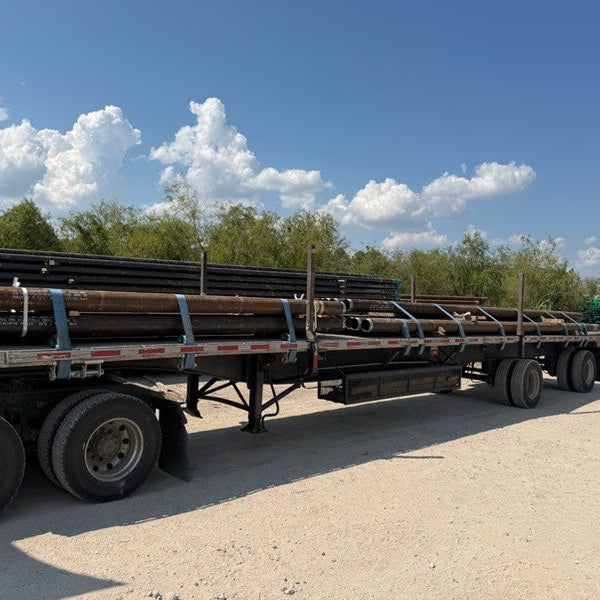 Micropile casing loaded on a flatbed for delivery