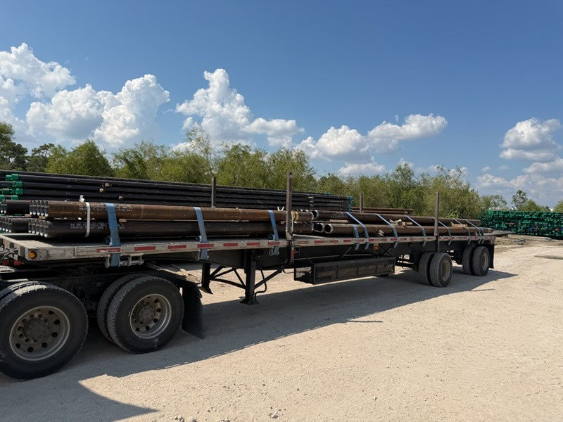 Micropile casing loaded on a flatbed for delivery